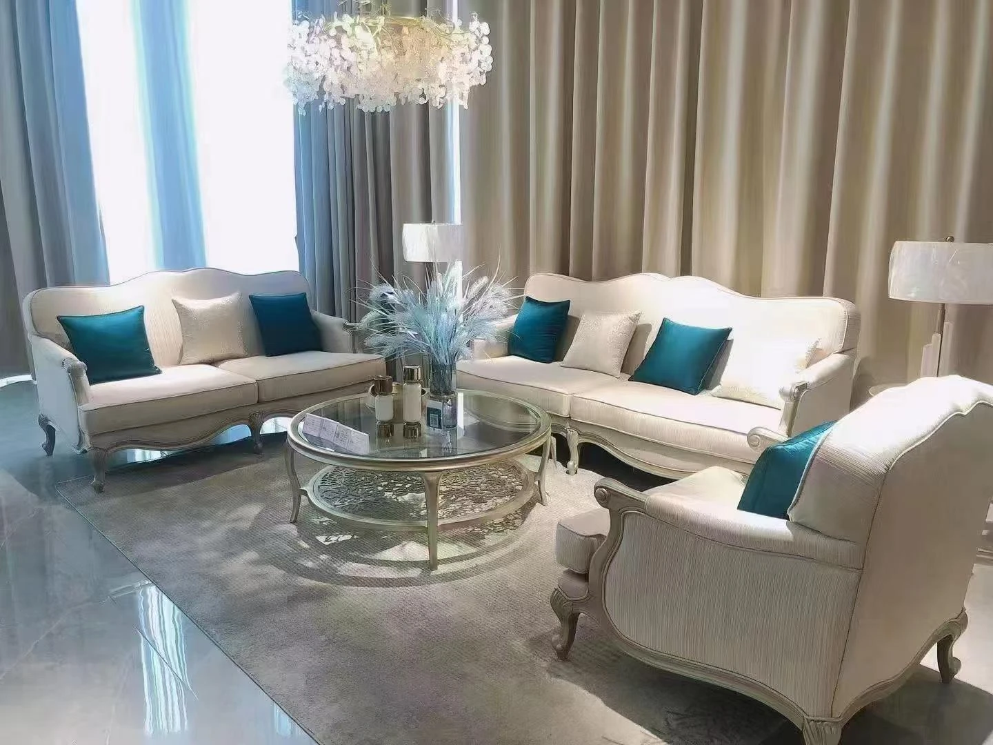 White sofas with blue accent pillows